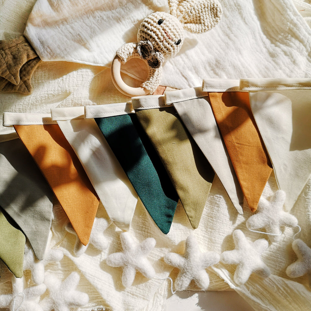 Beautiful handmade fabric bunting in soft earthy tones — olive green, forest green, light grey, off-white, and mustard ochre. Perfect for a woodland or boho-inspired nursery, birthday party, baby shower, or photo shoot. The Butter Fying